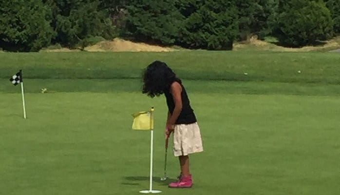 daycare activities young girl golfing